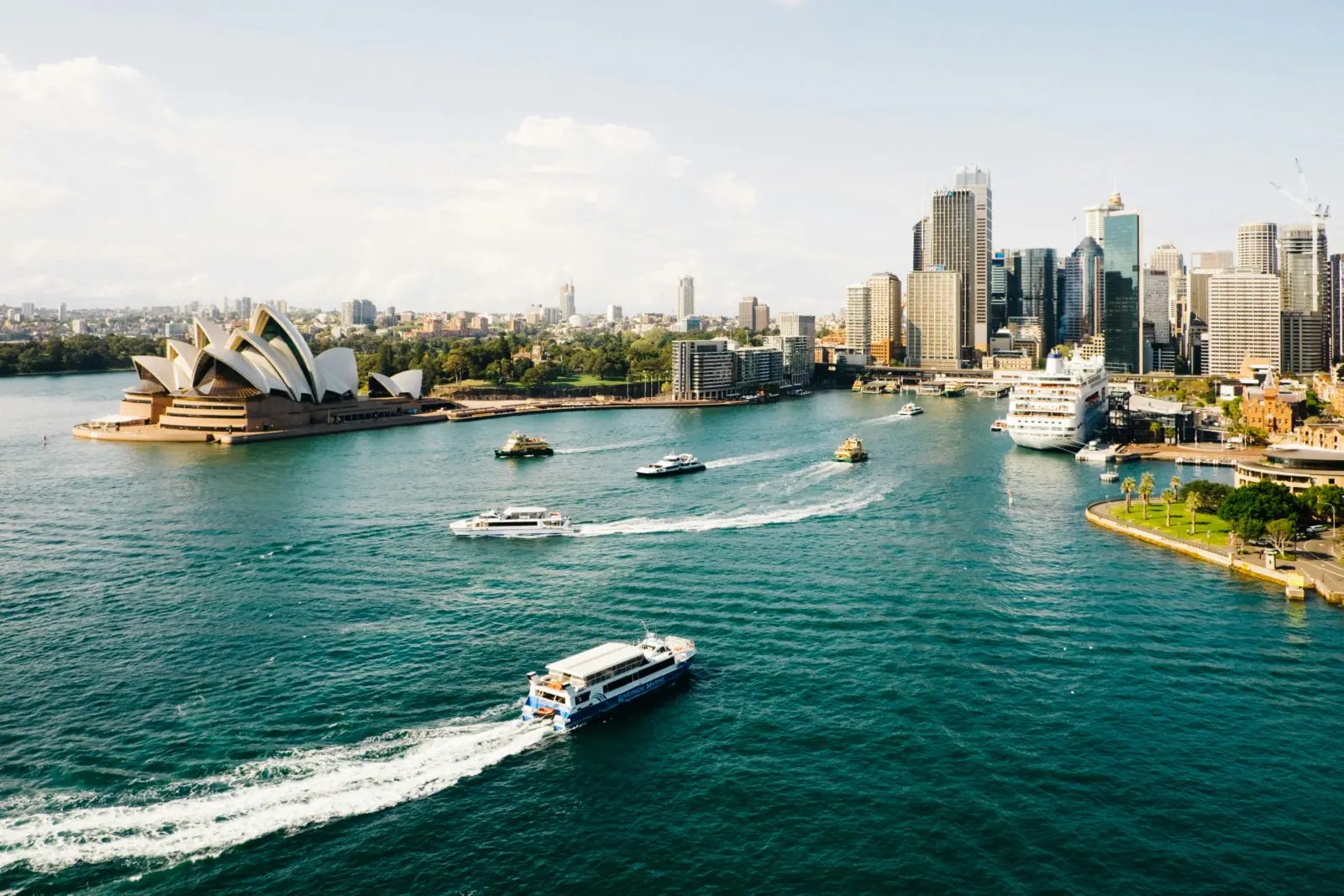 Moving to Australia from the USA: Sydney Harbour with the Opera House and a ferry crossing