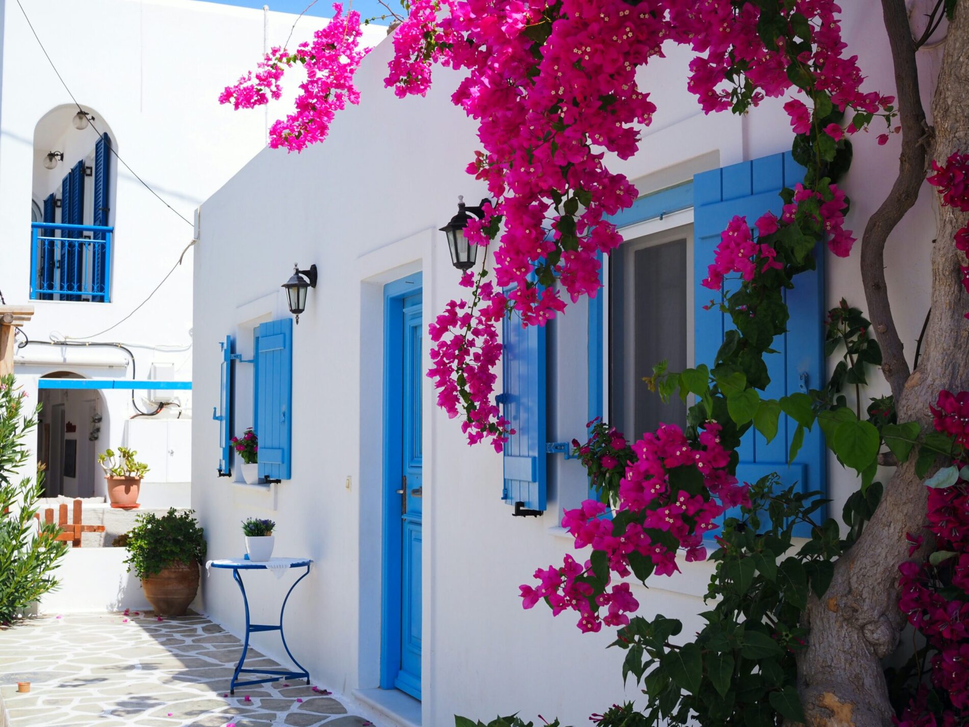 Greek island white blue architecture - Greece relocation incentive countries pay you move