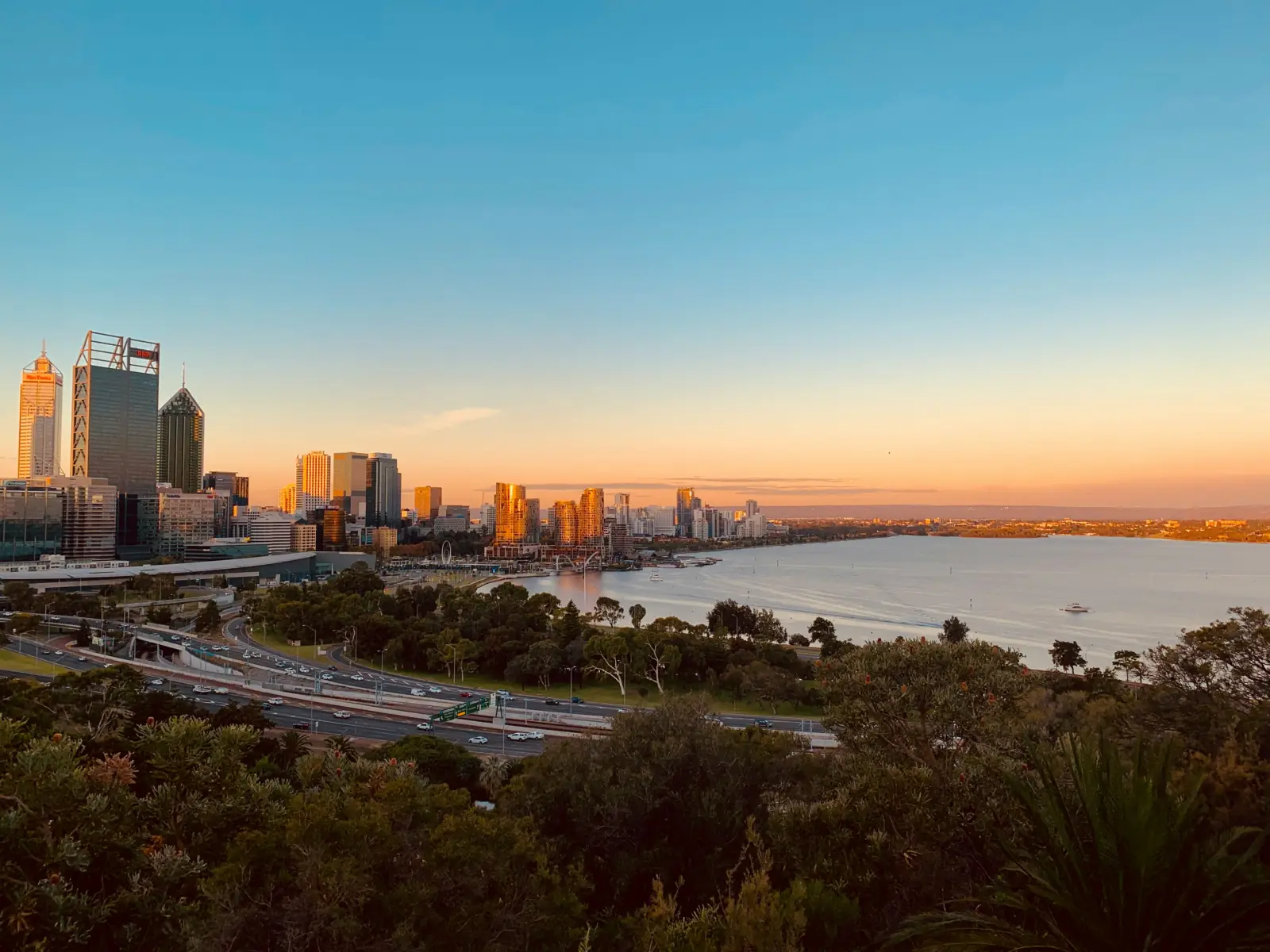 Moving to Australia from the USA: Perth city skyline at sunset over the Swan River