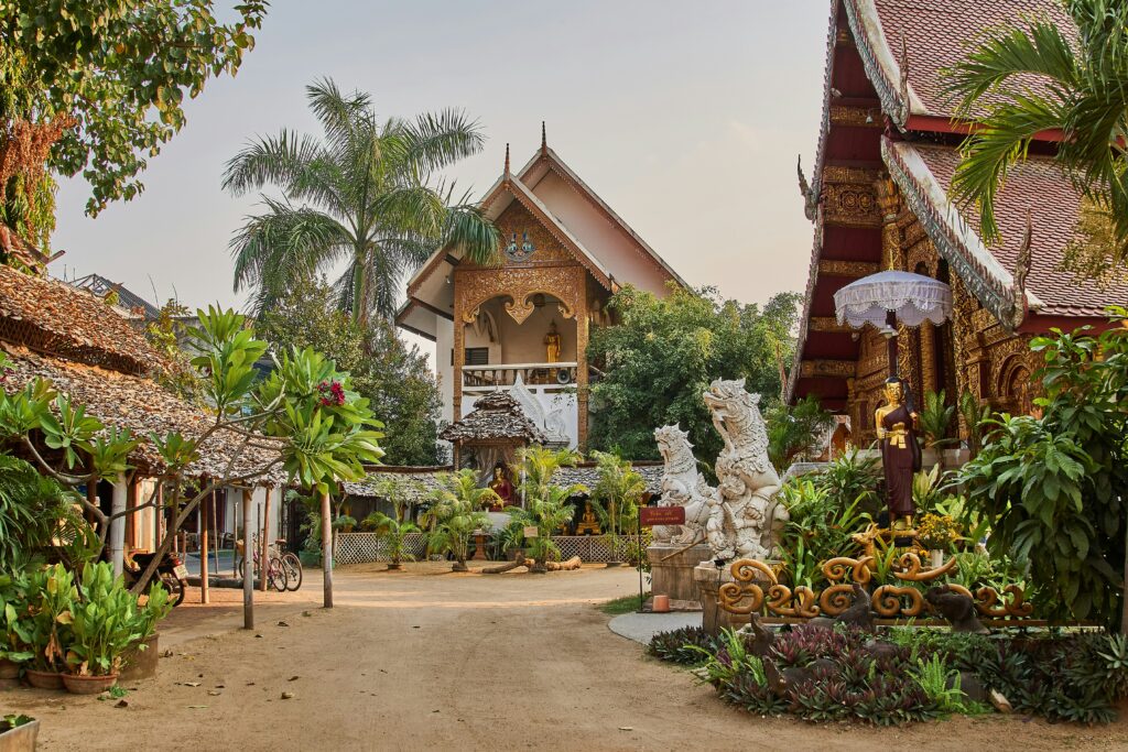 Traditional wooden buildings and lush greenery in Chiang Mai, Thailand