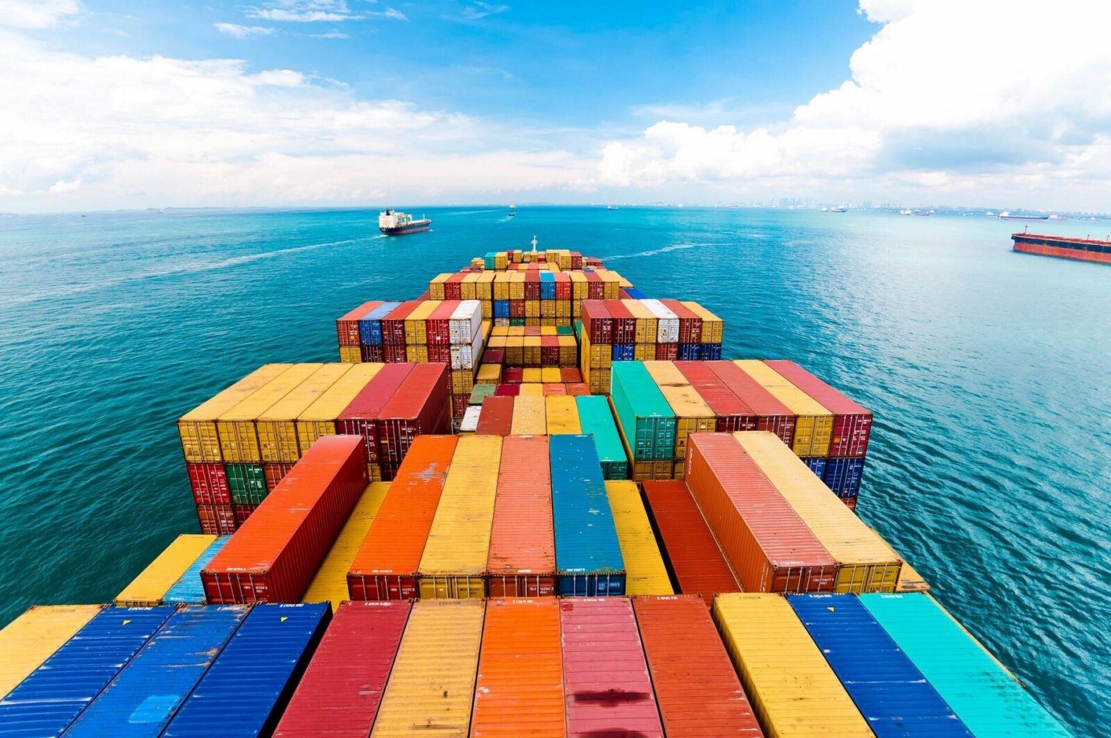 International shipping container vessel — BLUEmove ships household goods overseas for American families moving abroa
