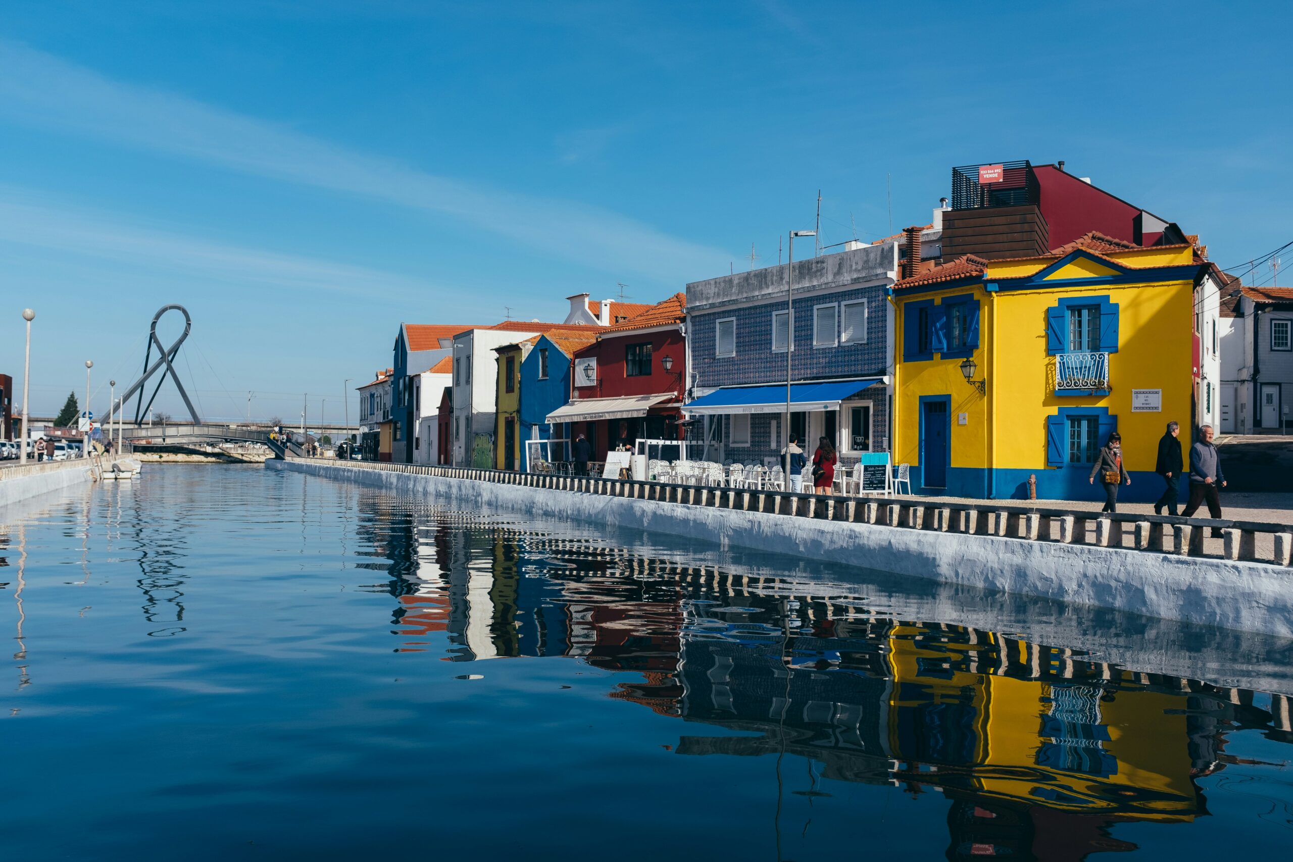 Colourful canal boats in Aveiro Portugal — moving to Portugal from the USA for American families and remote workers